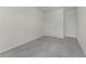 A minimalistic designed bedroom featuring neutral carpet and two white doors at 5217 Marshelder St, Apopka, FL 32712