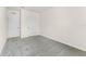 Bedroom with neutral carpet, white trim, and two doors at 5217 Marshelder St, Apopka, FL 32712