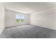 Carpeted bedroom featuring ample natural light and neutral walls at 5217 Marshelder St, Apopka, FL 32712