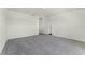 Large, bright bedroom with plush carpet and neutral walls offers a serene and comfortable space at 5217 Marshelder St, Apopka, FL 32712