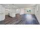 Open-concept living space with modern flooring and plenty of natural light at 5217 Marshelder St, Apopka, FL 32712