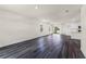 Large open-concept living space features modern flooring, recessed lighting, and flows into the kitchen at 5217 Marshelder St, Apopka, FL 32712