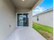 Covered outdoor patio with sliding glass doors, offering a seamless transition to indoor living at 5217 Marshelder St, Apopka, FL 32712