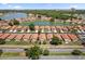 A stunning aerial view capturing residences beside a tranquil lake and a lush green landscape at 5337 Watervista Dr, Orlando, FL 32821