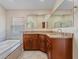 Bathroom featuring granite countertops, double vanity, tile flooring, and soaking tub at 5337 Watervista Dr, Orlando, FL 32821