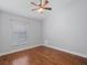 Bedroom with hardwood floors, ceiling fan and a window with blinds at 5337 Watervista Dr, Orlando, FL 32821