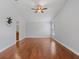 Large bedroom featuring hardwood floors, ceiling fan, and bright natural light at 5337 Watervista Dr, Orlando, FL 32821