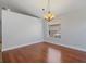 Empty dining room featuring hardwood floors, white walls, and a chandelier fixture at 5337 Watervista Dr, Orlando, FL 32821