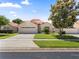 Inviting single-story home featuring a lush front lawn, mature landscaping, and a two-car garage at 5337 Watervista Dr, Orlando, FL 32821