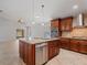 Spacious kitchen with a central island, stainless appliances and tile flooring at 5337 Watervista Dr, Orlando, FL 32821