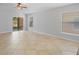 Bright living room featuring tile floors, ceiling fan, and sliding glass doors to the outside at 5337 Watervista Dr, Orlando, FL 32821