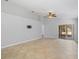 Large living room area with travertine tile floors and vaulted ceiling at 5337 Watervista Dr, Orlando, FL 32821