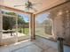 Screened patio featuring tile flooring, ceiling fan, view of the backyard, and shade at 5337 Watervista Dr, Orlando, FL 32821