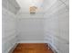 Spacious walk-in closet with plenty of storage space, wire racks, and hardwood floors at 5337 Watervista Dr, Orlando, FL 32821