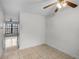 Empty bedroom with tile floors and access to additional room at 6095 Village Cir # 6095, Orlando, FL 32822