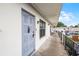 Apartment 6095 entrance with a decorative blue door and walkway at 6095 Village Cir # 6095, Orlando, FL 32822