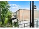 Exterior shot of the house, displaying roof, siding, balconies, landscaping, and ADT security at 6095 Village Cir # 6095, Orlando, FL 32822