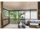 Comfortable, screened patio with a view of lush green lawn and landscaping at 6095 Village Cir # 6095, Orlando, FL 32822
