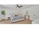 Bright bedroom featuring neutral tones, a ceiling fan, and a modern design at 702 N Sweetwater Blvd, Longwood, FL 32779
