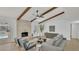 Bright and airy living room with a brick fireplace, vaulted ceiling, and modern furnishings at 702 N Sweetwater Blvd, Longwood, FL 32779