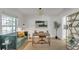 Stylish home office with a comfortable seating area, modern desk, and ample natural light at 702 N Sweetwater Blvd, Longwood, FL 32779