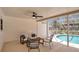 Relaxing screened-in patio area with pool views and modern seating at 702 N Sweetwater Blvd, Longwood, FL 32779