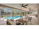 Inviting screened-in patio with comfortable seating and a refreshing pool view at 702 N Sweetwater Blvd, Longwood, FL 32779