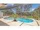 Beautiful screened-in pool area with tropical landscaping and ample sunlight at 702 N Sweetwater Blvd, Longwood, FL 32779