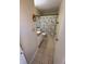Cozy bathroom with tiled floors, a single sink vanity, and a shower with patterned curtain at 710 Ridenhour Cir # 710, Orlando, FL 32809