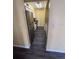 Galley kitchen with stainless steel appliances and dark wood-look flooring at 710 Ridenhour Cir # 710, Orlando, FL 32809