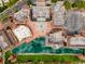 Aerial view showcasing a commercial district complete with a waterway and fountain at 7449 Sugar Bend Dr # 7449, Orlando, FL 32819