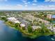 Aerial view of shops near the lake with ample parking, shops, dining and other businesses at 7449 Sugar Bend Dr # 7449, Orlando, FL 32819
