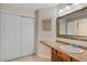 Bathroom featuring a vanity with an inset sink and a large mirror at 7449 Sugar Bend Dr # 7449, Orlando, FL 32819