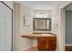 Bathroom featuring vanity with inset sink, ornate mirror, and three-bulb light fixture at 7449 Sugar Bend Dr # 7449, Orlando, FL 32819