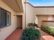 Exterior entryway featuring a garden, neutral color scheme, and access to a unit doorway at 7449 Sugar Bend Dr # 7449, Orlando, FL 32819