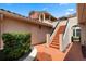 Exterior view with walkway, stairs, and neutral color scheme, leading to upper-level units at 7449 Sugar Bend Dr # 7449, Orlando, FL 32819