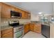 A well-maintained kitchen with granite countertops and stainless appliances at 7449 Sugar Bend Dr # 7449, Orlando, FL 32819