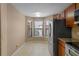 Bright kitchen with a bay window and stainless steel refrigerator at 7449 Sugar Bend Dr # 7449, Orlando, FL 32819