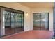 Screened porch with view through two sliding glass doors at 7449 Sugar Bend Dr # 7449, Orlando, FL 32819