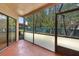 Spacious screened porch with a view of trees and other buildings at 7449 Sugar Bend Dr # 7449, Orlando, FL 32819