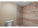 Shower featuring mosaic tile accent border and overhead shower head at 7449 Sugar Bend Dr # 7449, Orlando, FL 32819