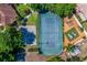 Aerial shot showcasing the tennis and basketball court with playground and park area nearby at 7449 Sugar Bend Dr # 7449, Orlando, FL 32819