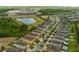 An aerial view shows homes, a pond and a highway at 7519 Marker Ave, Kissimmee, FL 34747