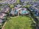 An aerial view of the resort-style community featuring a pool, splash pad, and grassy sports field at 7519 Marker Ave, Kissimmee, FL 34747