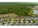 Aerial view of new community homes with landscaped yards near green space and highways at 7519 Marker Ave, Kissimmee, FL 34747