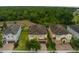 Aerial view of community homes, highlighting landscaping, and proximity to nature at 7519 Marker Ave, Kissimmee, FL 34747