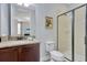 Bright bathroom featuring a shower, a toilet, and a vanity with lots of storage at 7519 Marker Ave, Kissimmee, FL 34747