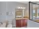 Elegant bathroom with a double sink vanity, granite countertops, and a glass-enclosed shower at 7519 Marker Ave, Kissimmee, FL 34747