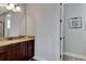Bathroom featuring a granite vanity and tile flooring at 7519 Marker Ave, Kissimmee, FL 34747