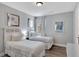 Cozy bedroom featuring two twin beds with white linens and wood-look flooring at 7519 Marker Ave, Kissimmee, FL 34747